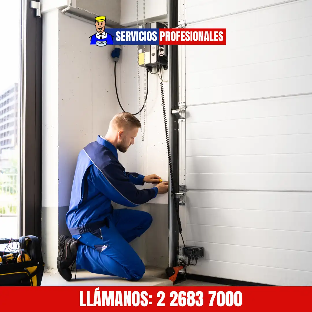 Ajuste de resortes y cables en puerta de garaje
